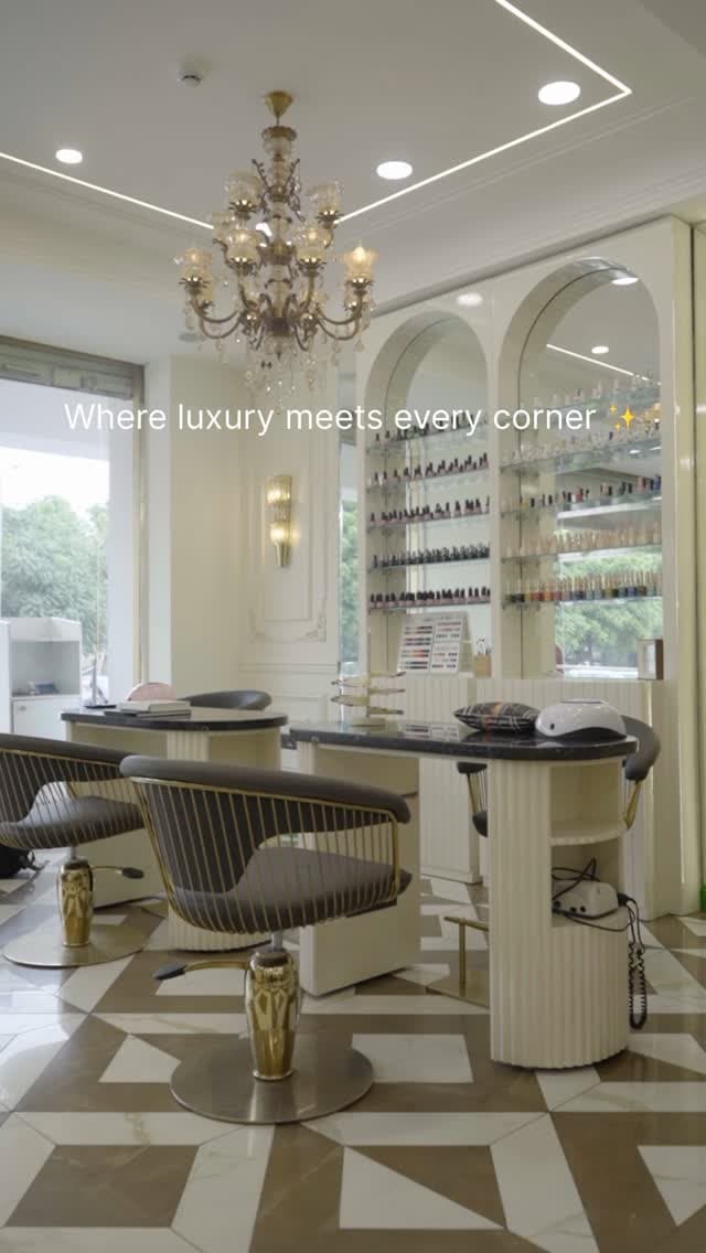 The salon floor beneath a crystal chandelier and wall of polishes