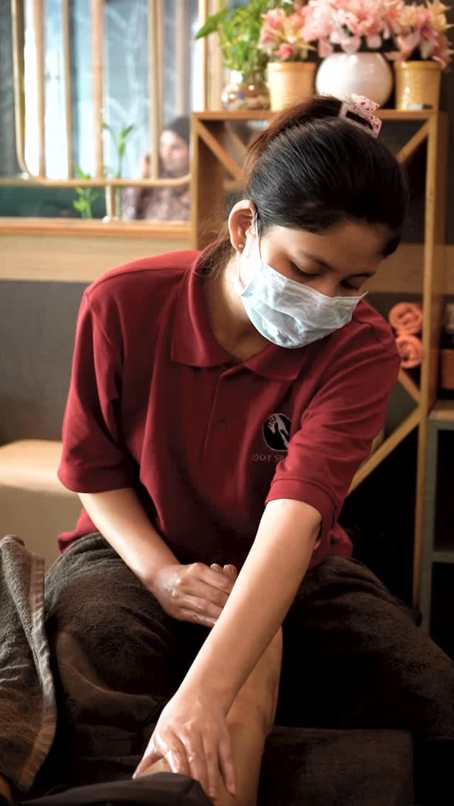 A therapist preparing a treatment room